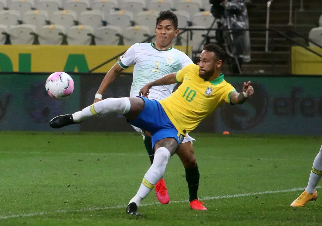 Brazil's Neymar (Front) and Bolivia's Jesus Sagredo vie for the ball during their 2022 FIFA World Cup South American qualifier football match at the Neo Quimica Arena, also known as Itaquerao, in Sao Paulo, Brazil, on October 9, 2020, amid the COVID-19 novel coronavirus pandemic. (Photo by AMANDA PEROBELLI / POOL / AFP)