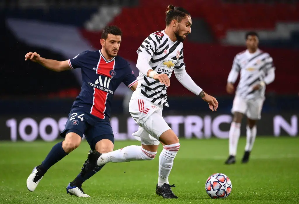 Manchester United's Brazilian defender Alex Telles (R) vies for the ball with Paris Saint-Germain's Italian defender Alessandro Florenzi  during the UEFA Champions League Group H first-leg football match between Paris Saint-Germain (PSG) and Manchester United at the Parc des Princes stadium in Paris on October 20, 2020. (Photo by FRANCK FIFE / AFP)