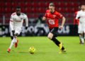 Maxwell Cornet of Lyon  AND Flavien Tait of Rennes during the Ligue 1 match between Rennes and Lyon at Roazhon Park on January 9, 2021 in Rennes, France. (Photo by Vincent Michel/Icon Sport) - Flavien TAIT - Maxwell CORNET - Roazhon Park - Rennes (France)