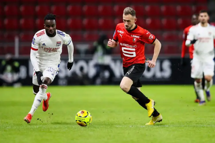 Maxwell Cornet of Lyon  AND Flavien Tait of Rennes during the Ligue 1 match between Rennes and Lyon at Roazhon Park on January 9, 2021 in Rennes, France. (Photo by Vincent Michel/Icon Sport) - Flavien TAIT - Maxwell CORNET - Roazhon Park - Rennes (France)