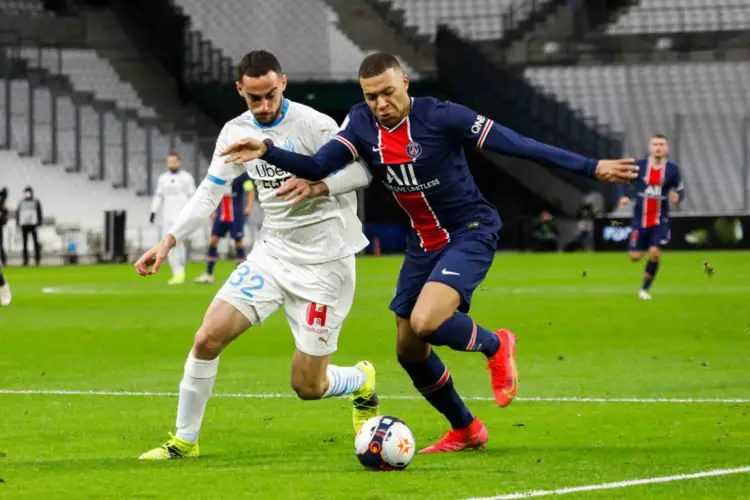 Lucas PERRIN of Marseille and Kylian MBAPPE of PSG