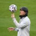 24 March 2021, North Rhine-Westphalia, Duisburg: Football: National team, final training National team before the World Cup qualifier against Iceland. German coach Joachim Löw holds the ball on his index finger.
