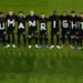 The players of the German national team stand together and form the lettering "Human Rights"