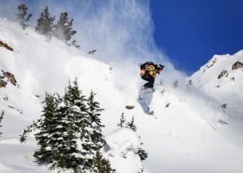 This image taken on February 7, 2020 shows freeride snowboarder Marion Haerty of France competing during the Women's snowboard event of the second stage of the Freeride World Tour skiing and snowboarding competition in Kicking Horse Mountain Resort above Golden, British Columbia, Canada. (Photo by Fabrice COFFRINI / AFP)