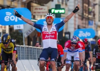 Team Trek rider Belgium's Jasper Stuyven (C) celebrates as he crosses the finish line to win the one-day classic cycling race Milan-San Remo on March 20, 2021 in San Remo. (Photo by Tommaso PELAGALLI / AFP)