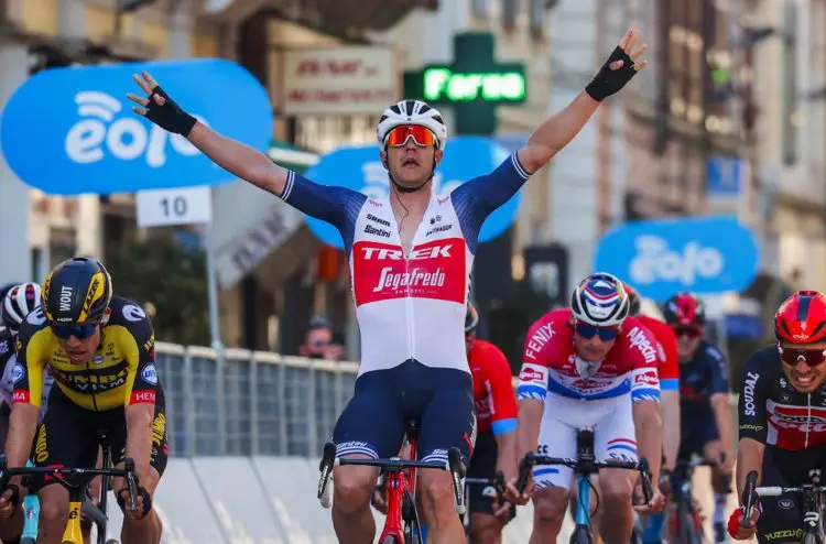 Team Trek rider Belgium's Jasper Stuyven (C) celebrates as he crosses the finish line to win the one-day classic cycling race Milan-San Remo on March 20, 2021 in San Remo. (Photo by Tommaso PELAGALLI / AFP)