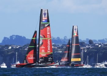 Team New Zealand (L) competes against Luna Rossa Prada during the 36th America's Cup in Auckland on March 17, 2021. (Photo by Gilles Martin-Raget / AFP)