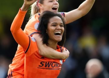 Lyon's Eugenie Le Sommer jumps on the back of captain Wendie Renard as they celebrate getting through to the final during the UEFA Women's Champions League semi final second leg match at the Cherry Red Records Stadium, London on 28th April 2019  Photo : PA Images / Icon Sport