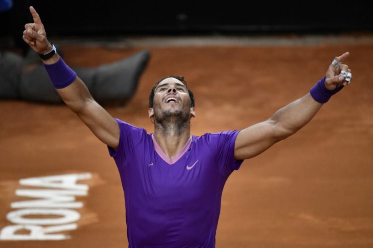 Spain's Rafael Nadal celebrates after defeating Serbia's Novak Djokovic during the final of the Men's Italian Tennis Open at Foro Italico on May 16, 2021 in Rome, Italy. (Photo by Filippo MONTEFORTE / AFP)