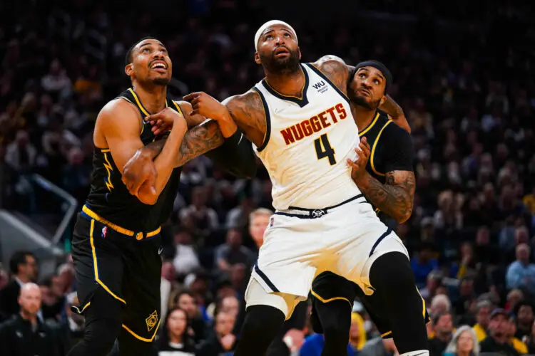 Apr 27, 2022; San Francisco, California, USA; Denver Nuggets center DeMarcus Cousins (4) battles for position with Golden State Warriors forward Otto Porter Jr. (32) and guard Gary Payton II (0) in the fourth quarter during game five of the first round for the 2022 NBA playoffs at Chase Center. Mandatory Credit: Cary Edmondson-USA TODAY Sports/Sipa USA - Photo by Icon sport