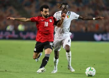 Mohamed Salah of Egypt is challenged by of Guinea during the 2023 Africa Cup of Nations qualifying football match between Egypt and Guinea held at Cairo International Stadium, Cairo,Egypt on 5 June 2022 ©Weam Mostafa/Sports Inc - Photo by Icon sport