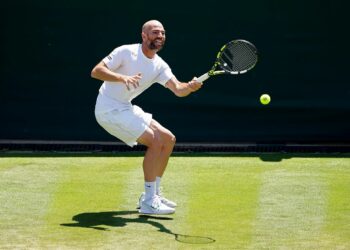 Adrian Mannarino in action against Daniil Medvedev (not pictured) on day five of the 2023 Wimbledon Championships at the All England Lawn Tennis and Croquet Club in Wimbledon. Picture date: Friday July 7, 2023. - Photo by Icon sport