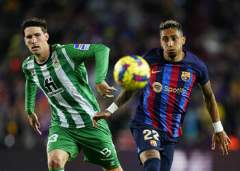 Juan Miranda of Real Betis and Raphael Dias Belloli Raphinha of FC Barcelona during the La Liga match between FC Barcelona and Real Betis played at Spotify Camp Nou Stadium on April 29, 2023 in Barcelona, Spain. (Photo by Sergio Ruiz / Pressinphoto / Icon Sport) - Photo by Icon sport