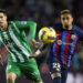Juan Miranda of Real Betis and Raphael Dias Belloli Raphinha of FC Barcelona during the La Liga match between FC Barcelona and Real Betis played at Spotify Camp Nou Stadium on April 29, 2023 in Barcelona, Spain. (Photo by Sergio Ruiz / Pressinphoto / Icon Sport) - Photo by Icon sport
