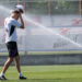 22 August 2023, Bavaria, Munich: Coach Thomas Tuchel cools off on a jet of water during his team's public training session. Photo: Peter Kneffel/dpa - IMPORTANT NOTE: In accordance with the requirements of the DFL Deutsche Fuball Liga and the DFB Deutscher Fuball-Bund, it is prohibited to use or have used photographs taken in the stadium and/or of the match in the form of sequence pictures and/or video-like photo series. - Photo by Icon sport
