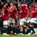 Manchester United's Raphael Varane (second right) celebrates scoring their side's first goal of the game with team-mates Bruno Fernandes, Victor Lindelof, Luke Shaw and Marcus Rashford (right) during the Premier League match at Old Trafford, Manchester. Picture date: Monday August 14, 2023. - Photo by Icon sport