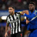 Newcastle United's Callum Wilson tussles with Chelsea's Benoit Badiashile during the Carabao Cup quarter final match at Stamford Bridge, London. Picture date: Tuesday December 19, 2023. - Photo by Icon sport
