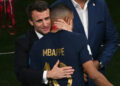 France's President Emmanuel Macron hugs France's Kylian Mbappe. PictureAlliance / Icon Sport