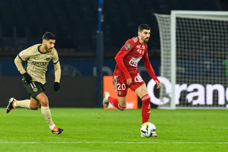 Pierre LEES-MELOU of Brest and Marco ASENSIO of Paris SG during the Ligue 1 Uber Eats match between Paris Saint-Germain Football and Stade Brestois 29 at Parc des Princes on January 28, 2024 in Paris, France. (Photo by Daniel Derajinski/Icon Sport)