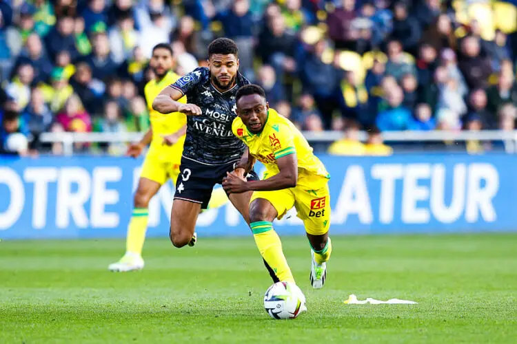 Matthieu Udol of Metz and Benie Traore of Nantes during the Ligue 1 Uber Eats match between Nantes and Metz at Beaujoire Stadium on March 3, 2024 in Nantes, France. (Photo by Loic Baratoux/FEP/Icon Sport)   - Photo by Icon Sport