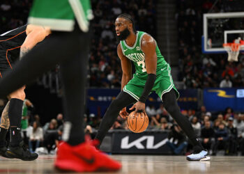 Mar 22, 2024; Detroit, Michigan, USA; Boston Celtics guard Jaylen Brown (7) dribbles up the court against the Detroit Pistons in the third quarter at Little Caesars Arena. Mandatory Credit: Lon Horwedel-USA TODAY Sports/Sipa USA   - Photo by Icon Sport
