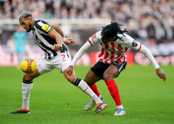 Newcastle United's Joelinton (left) and Sunderland's Pierre Ekwah battle for the ball during the Emirates FA Cup Third Round match at the Stadium of Light, Sunderland. Picture date: Saturday January 6, 2024. - Photo by Icon sport   - Photo by Icon Sport