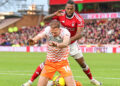 Jordan Rhodes of Blackpool and Nuno Tavares of Nottingham Forest clash during the Emirates FA Cup Third Round match Nottingham Forest vs Blackpool at City Ground, Nottingham, United Kingdom, 7th January 2024 (Photo by Mark Cosgrove/News Images) in Nottingham, United Kingdom on 1/7/2024. (Photo by Mark Cosgrove/News Images/Sipa USA) - Photo by Icon sport   - Photo by Icon Sport