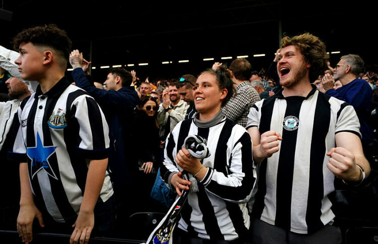 Newcastle United fans celebrate the win in the stands after the Premier League match at Craven Cottage, London. Picture date: Saturday April 6, 2024.   - Photo by Icon Sport