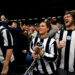 Newcastle United fans celebrate the win in the stands after the Premier League match at Craven Cottage, London. Picture date: Saturday April 6, 2024.   - Photo by Icon Sport