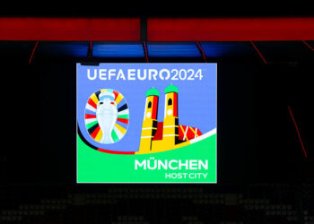 22 April 2024, Bavaria, Munich: The UEFA Euro 2024 logo for the "Host City" Munich can be seen on a display board in the Allianz Arena. Federal Minister of the Interior Faeser visited all ten German host cities for the 2024 European Football Championship as part of a tour. The opening match of the European Championship will take place in Munich on June 14, 2024. Photo: Sven Hoppe/dpa   - Photo by Icon Sport
